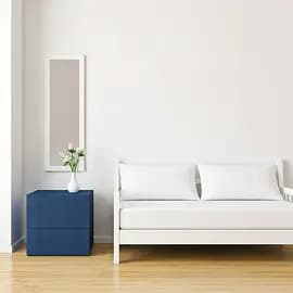 A freshly made bed in a short-let bedroom